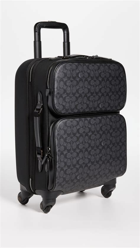 coach suitcase with wheels.